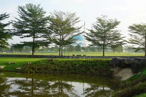 Mosque With Blue Dome Reflected In Pond Stock Photos