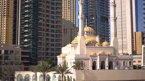 Mosque in Dubai surrounded by skyscrapers Stock Footage 224317740