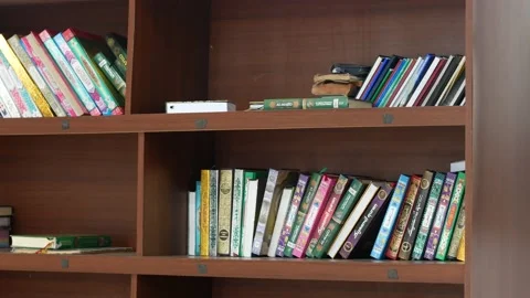 Mosque library shelves, containing the Qur'an and other Islamic books. Cirebo Stock Footage 163859391