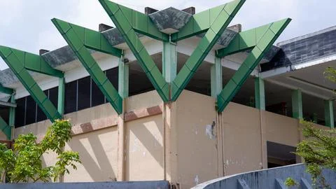 Mosque With Sharp Triangular Pillars Above The Building Stock Photos