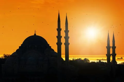 Mosque silhouette during sunset Stock Photos