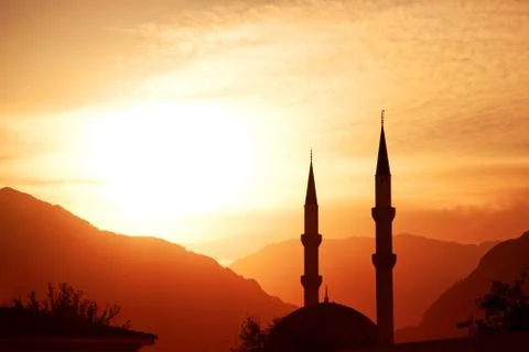Mosque silhouette at sunset 스톡 사진