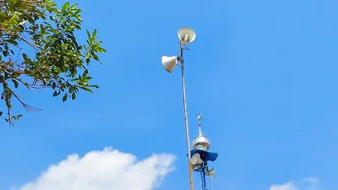 Mosque speaker system captured under sunny blue sky Stock Photos