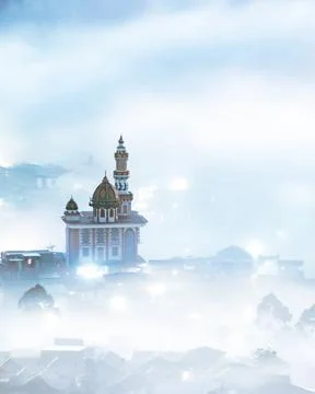 Mosque surrounded by the clouds Stock Photos