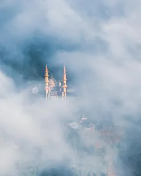 Mosque surrounded by the clouds Stock Photos