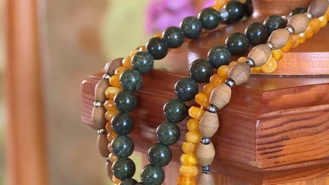 Mosque tree wall rosary prayer religion islam shrine movement down panorama 0 Stock Footage 106758044