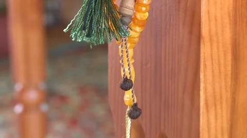 Mosque tree wall rosary prayer religion islam shrine movement up panorama 016 Stock Footage 106758056