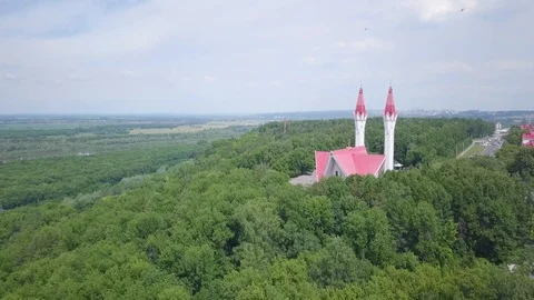 Mosque with two towers at the edge of the forest Stock Footage 92369097