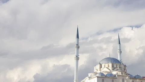 Mosque under cloudy skies, a serene Islamic  background for Ramadan themes. Stock Footage 291509881