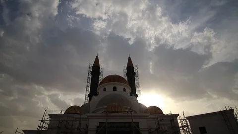 Mosque under construction with two minarets covered in scaffolding (time lapse) Stock Footage 124981079