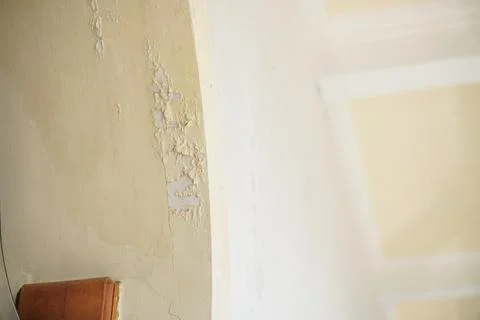 The mosque wall paint is peeling due to poor paint quality Stock Photos