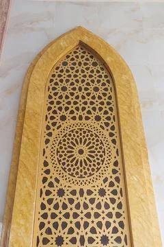 Mosque wall texture featuring Islamic elements. Stock Photos