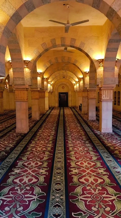 The mosques interior features ornate carpets, stone arches and ceiling fans. Stock Footage 348248188