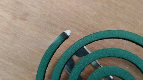 Mosquito coil in the shape of a circle that is burned Stock Footage 308995962