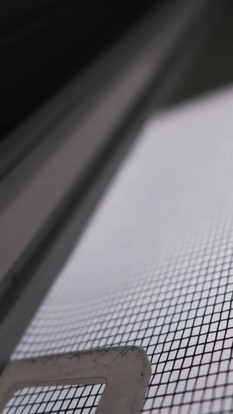 Mosquito Net Mesh Texture in Extreme Macro Close Up Against Dark Window Stock Footage 334736194