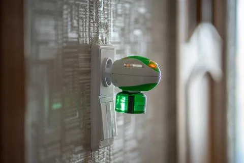 Mosquito repellent with plug into the socket at home. Electric insect repel.. Stock-Fotos