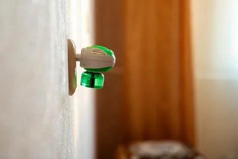 Mosquito repellent with plug into the socket at home closeup. Insect repellent Stock-Fotos