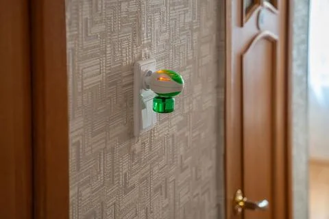 Mosquito repellent with plug into the socket at home closeup. Insect repellent Stock-Fotos