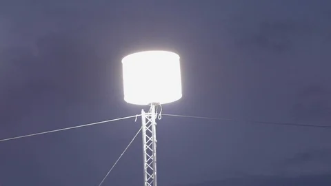 Mosquitos around Light projector at the beach in the stands of a sport event. Stock-Footage 107818065