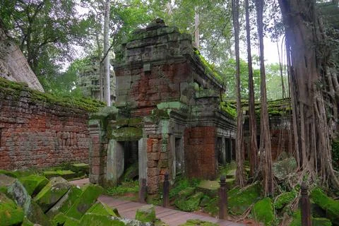 Moss-Covered Stone Tower and Intricate Carvings at Ta Prohm Temple Stock Photos