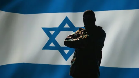 Mossad agent standing proud in front of Israel flag Stock Footage 278293542