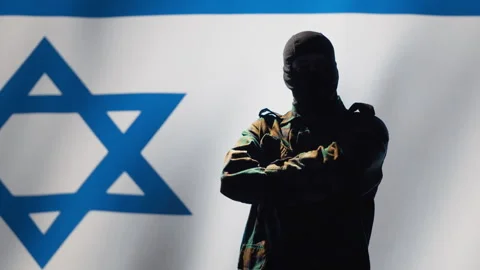 Mossad agent standing proud in front of Israel flag Stock Footage 278294080
