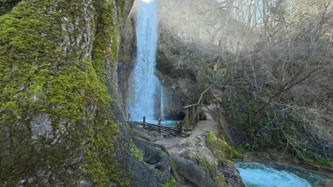 Mossy rocks frame a gentle waterfall. Mount Ozren Vidéo 330934103