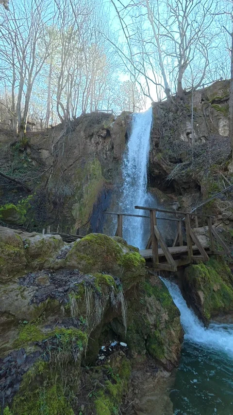 Mossy rocks frame a rushing waterfall. Balkan, Eastern Europe, POV Video stock 333634241