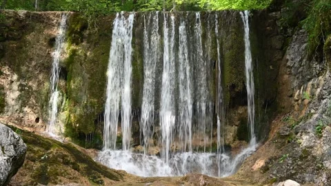 A mossy waterfall in the mountains (sunlight) Stock-Footage 217383067