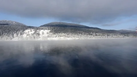 Most beautiful river in the winter. Snow-covered trees on the river bank. Aerial Video stock 73071230