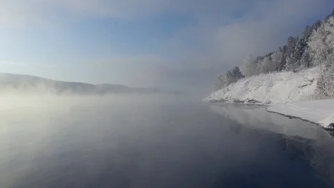 Most beautiful river in the winter. Snow-covered trees on the river bank. Aerial Video stock 73071254