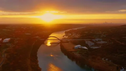 Most beautiful sunrise over 360 Pennybacker Bridge Lake Austin flyby aerial view Stock Footage 229677399