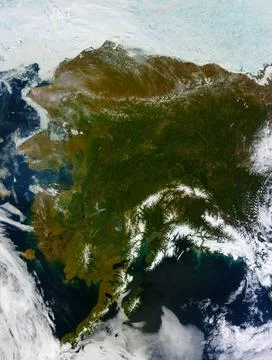 On most days, relentless rivers of clouds wash over Alaska, obscuring most... Fotos de archivo