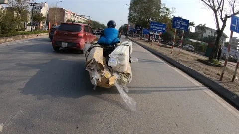 The most mind-boggling stuff people carry on their motorcycles in Vietnam Video stock 272918772