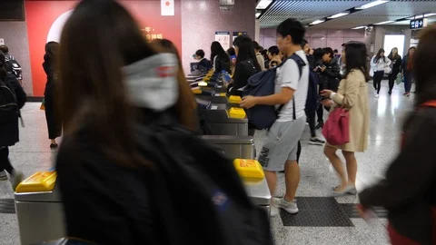 Most of passengers use contactless payment methods to enter MTR station Stock Footage 90566938