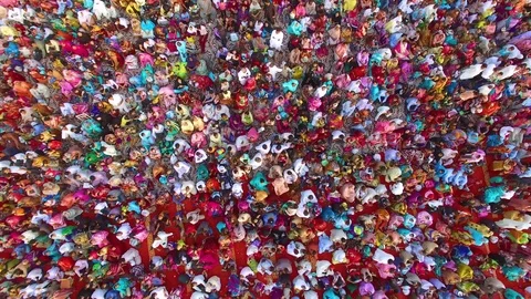Most unique zoom out rotation aerial shot of people in thousands in festival Stock Footage