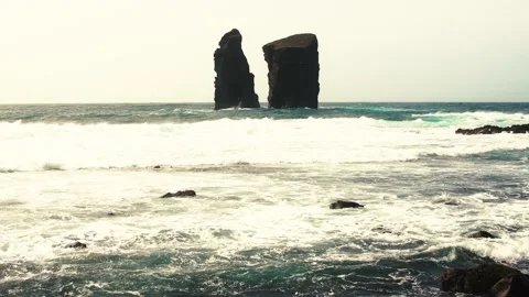 Mosteiros beach waves crashing on rocks and sand by the seashore Vídeos de archivo 239346154