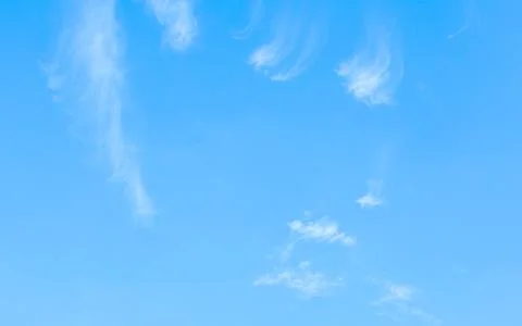 Mostly clear sky with small nice white cloud. Stock Photos
