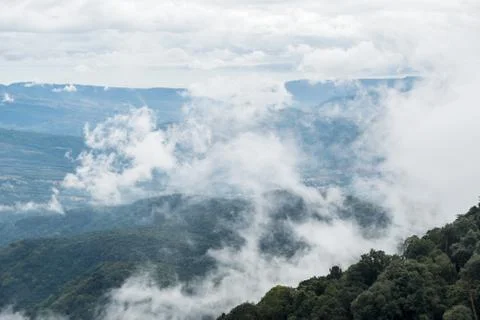 Mostly cloudy is covering the high mountain. Foto stock