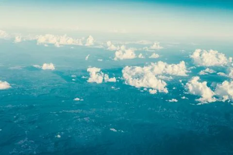 Mostly cloudy, with a view from the plane. Stock Photos