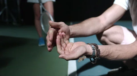 Moth flying from cupped hands at night, slow motion, on tennis court Stock Footage 63821779