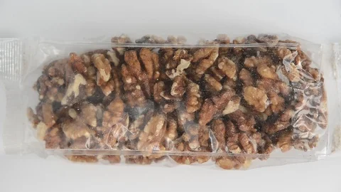 Moth insect crawling into walnut package Stock Footage 122312157