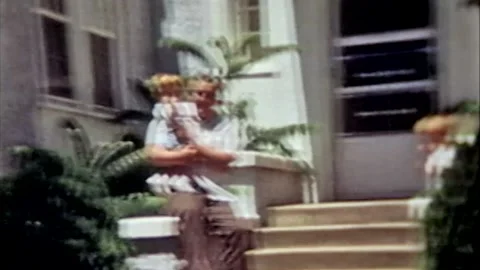 Mother and 2 sons visiting Grandpa Stock Footage 194568724