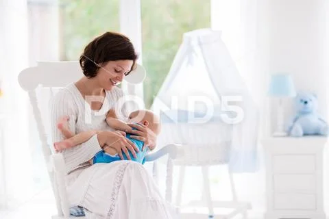 Mother and baby in bedroom Stock Photos