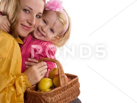 Mother and baby daughter with basket of apples Stock Photos