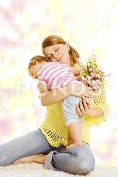 Mother and Baby Gives Flower Bouquet Gift, Happy Mom Embracing Kid Girl Stock Photos