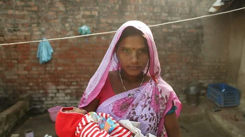 Mother and baby together in rural India villageStock Footage