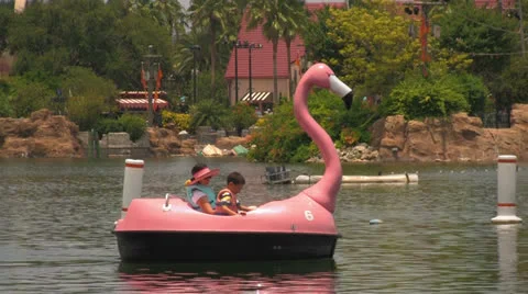 Mother and Child Having Fun in Paddle Boat at Theme Park Stock Footage 23690124
