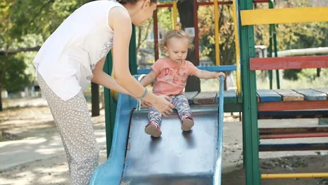 Mother and child play on the Playground Stock Footage 108550737
