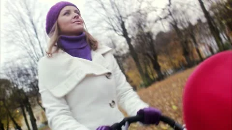 Mother and child walking in a park Stock Footage